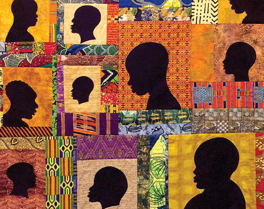 Colorful quilt featureing black silhouettes of Black people. 