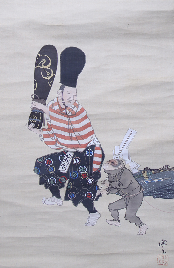 Traditional japanese scroll painting of a man training a monkey