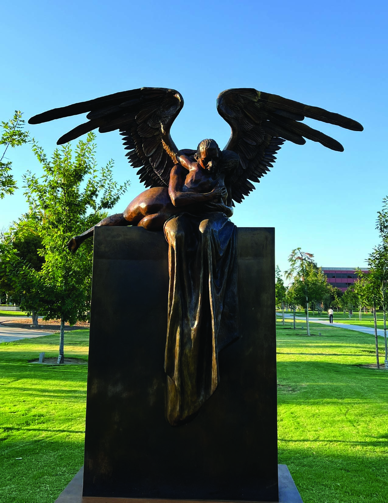 An intimate moment of absolute compassion and devotion. Two bodies that strive to become one. In this sculpture, a winged man holds a woman who seems to be slipping away from her, as if he&#39;s witnessing her last breath from her in a moment of transcendence.