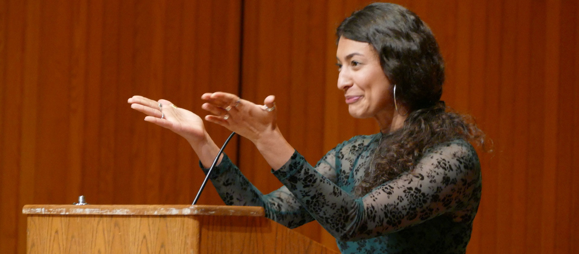 Communication graduate dean's medalist Ayla Mora speeks at Arts in Motion ceremony