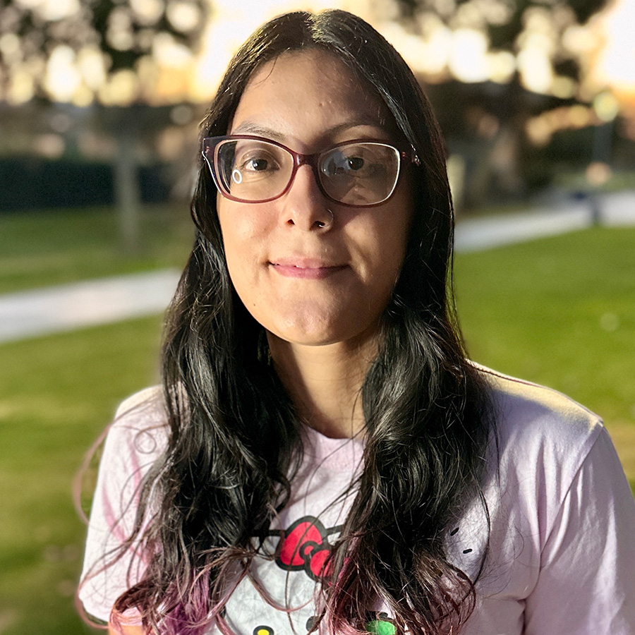 Headshot of Destiny with trees in background.