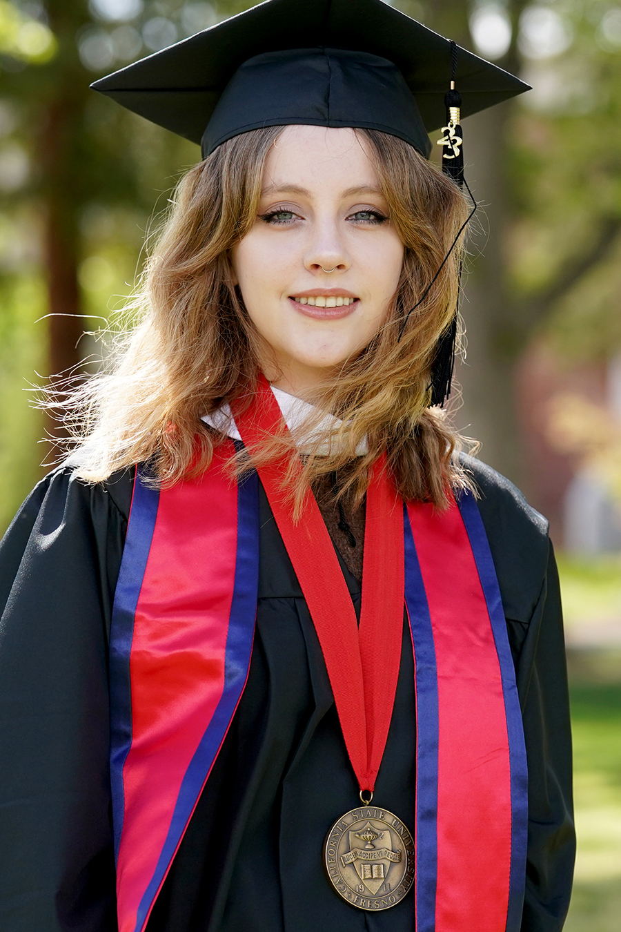portrait of mialise carney in cap and gown