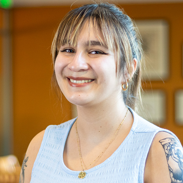 Headshot of Antonia inside the library.