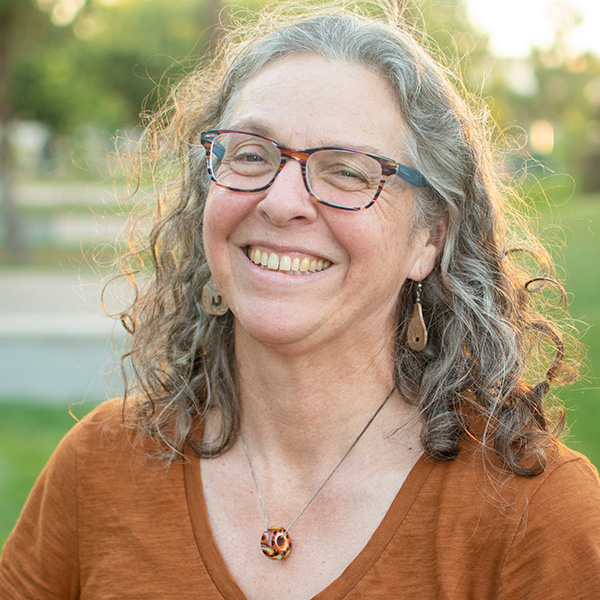 Headshot of Alison in the peace garden.