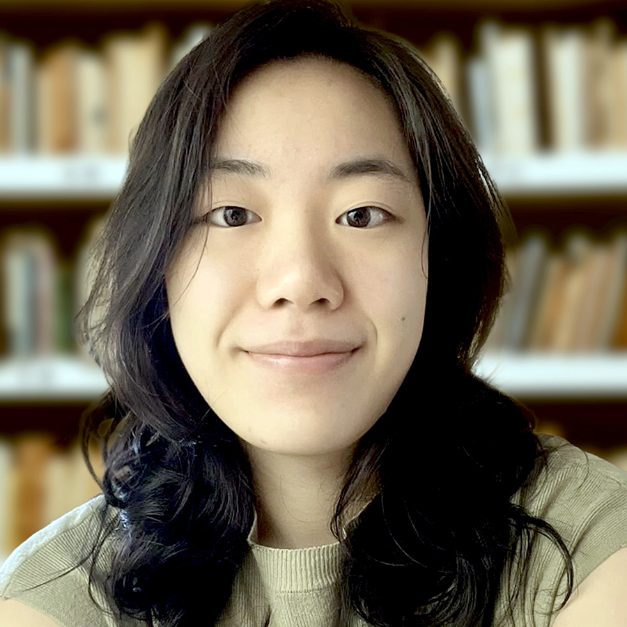 Headshot of Ivy with books in background.