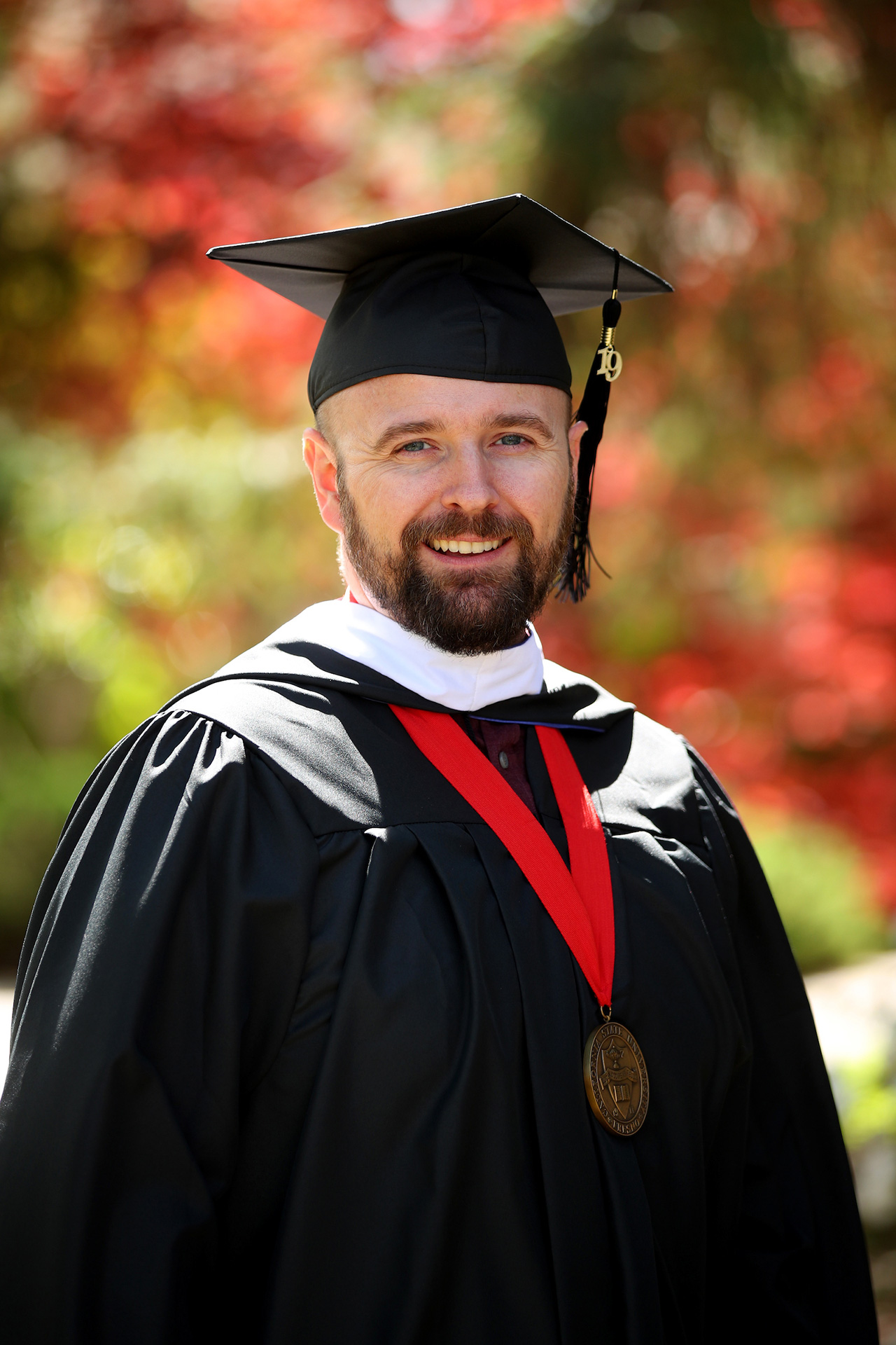 2019 Graduate Dean's Medalist Mason Lamb in graduation regalia