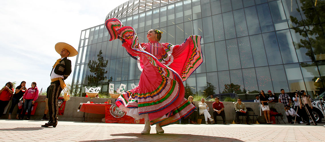 Folklorico dancers in front of the Fresno State Library