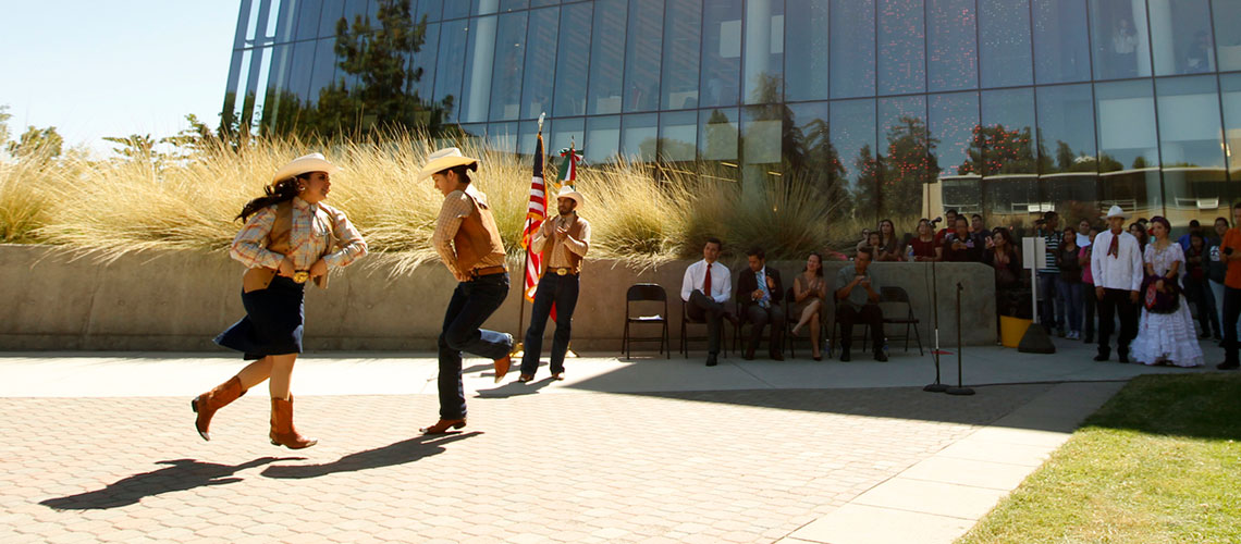 Dancers in front of the Fresno State Library