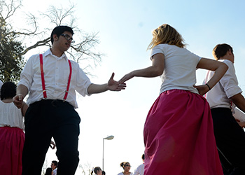 Portuguese students engage in a traditional dance.