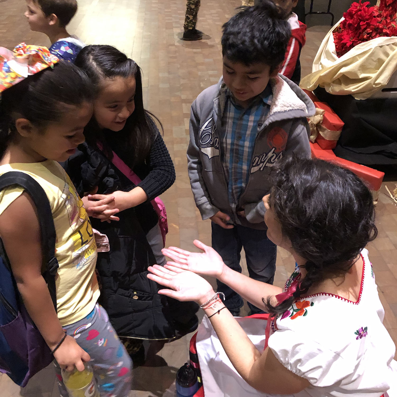Alejandra Tejeda meets with elementry school students after a performance.
