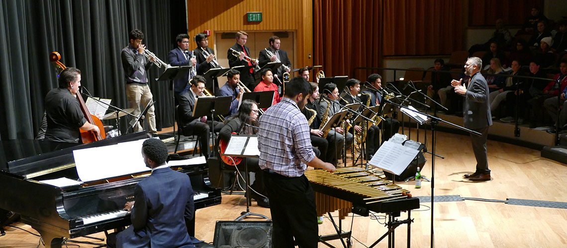 Richard Lloyd Giddens Jr. directs the Fresno State Jazz Orchestra in the Concert Hall.