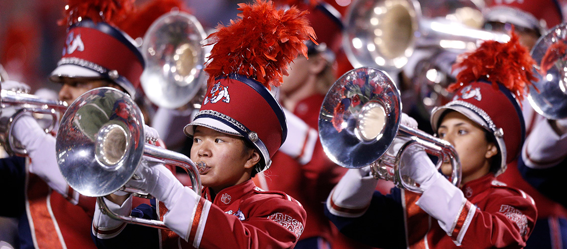 The Bulldog Marching Band horn players perform.