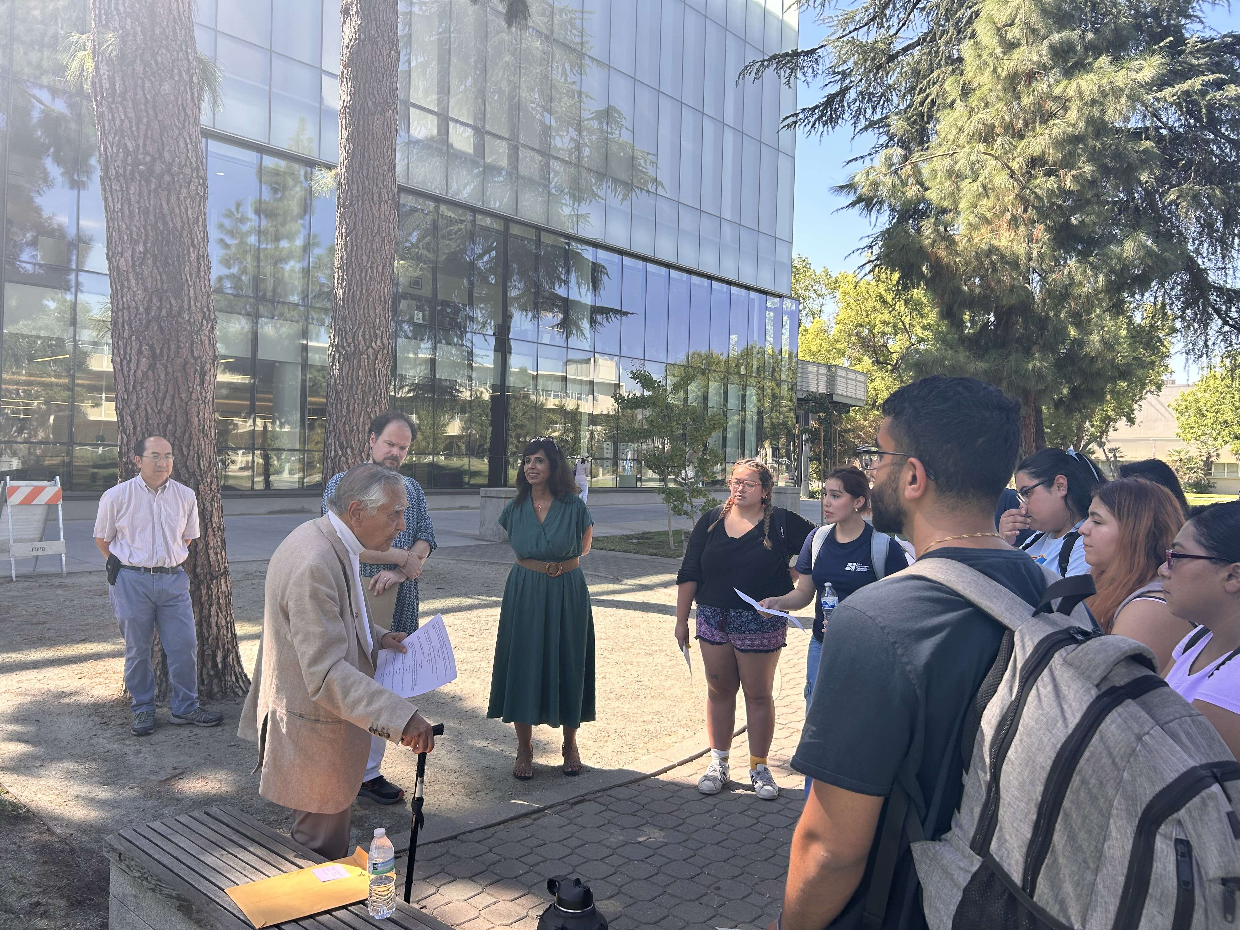 Dr. Kapoor, Prof. Howard, and Prof. Rosenhagen with students in the Peace Garden 